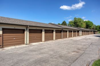 a row of garages with wooden doors